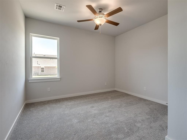 13136 Mannington Rd, Edmond, OK 73025 - spare room featuring a ceiling fan, carpet flooring, and baseboards
