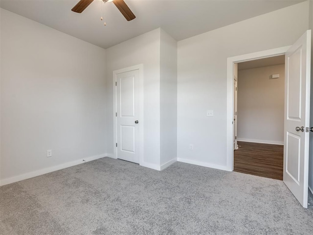 13136 Mannington Rd, Edmond, OK 73025 - unfurnished room with carpet, ceiling fan, and baseboards