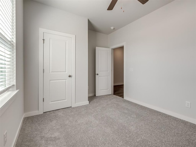 13136 Mannington Rd, Edmond, OK 73025 - unfurnished bedroom featuring carpet floors, baseboards, and a ceiling fan