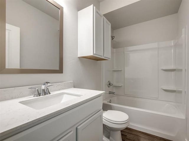 13136 Mannington Rd, Edmond, OK 73025 - bathroom with wood finished floors, toilet, vanity, and  shower combination