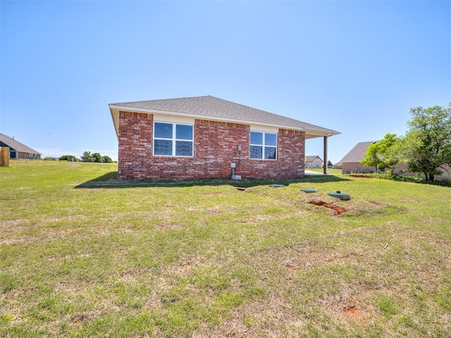 13136 Mannington Rd, Edmond, OK 73025 - rear view of house with a yard and brick siding