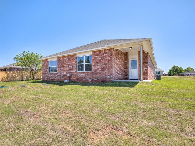 13136 Mannington Rd, Edmond, OK 73025 - rear view of house featuring brick siding