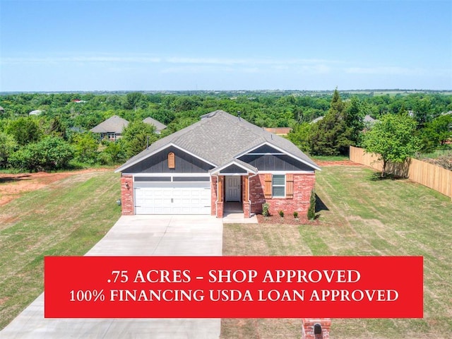 13136 Mannington Rd, Edmond, OK 73025 - view of front facade with an attached garage, brick siding, and concrete driveway