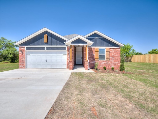 13136 Mannington Rd, Edmond, OK 73025 - view of front of home with concrete driveway, an attached garage, brick siding, and board and batten siding
