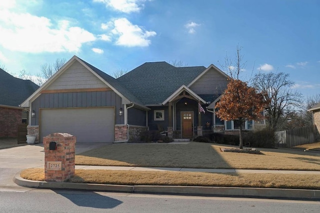 craftsman-style house with a garage and a front lawn