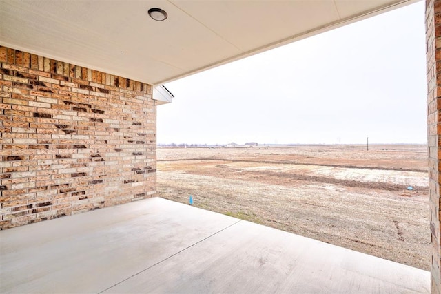 view of patio with a rural view