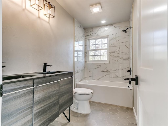 full bath featuring vanity, tile patterned flooring, toilet, and shower / tub combination
