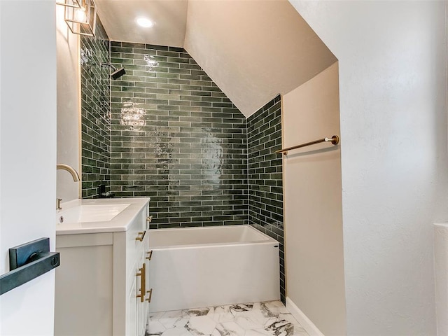 full bath with vanity and marble finish floor