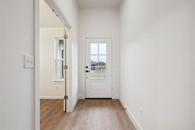 doorway with light hardwood / wood-style flooring