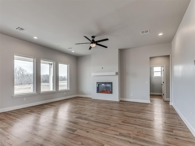 6209 Rivergate Dr, Shawnee, OK 74804 - unfurnished living room with ceiling fan and light wood-type flooring