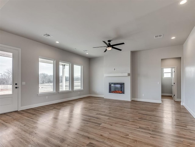 6209 Rivergate Dr, Shawnee, OK 74804 - unfurnished living room with ceiling fan, plenty of natural light, and light wood-type flooring