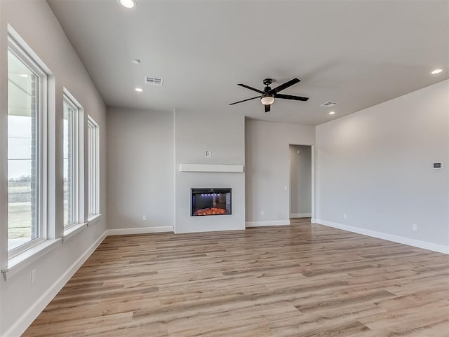6209 Rivergate Dr, Shawnee, OK 74804 - unfurnished living room with ceiling fan and light wood-type flooring