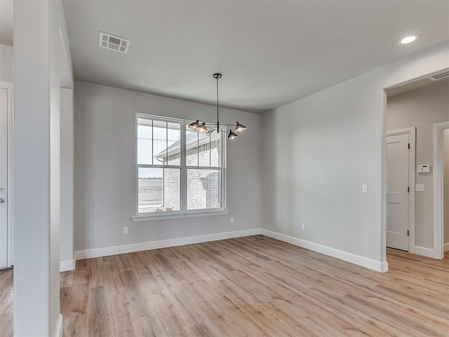 6209 Rivergate Dr, Shawnee, OK 74804 - unfurnished dining area with an inviting chandelier and light wood-type flooring
