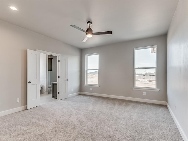 6209 Rivergate Dr, Shawnee, OK 74804 - unfurnished bedroom featuring light carpet, ceiling fan, and ensuite bathroom