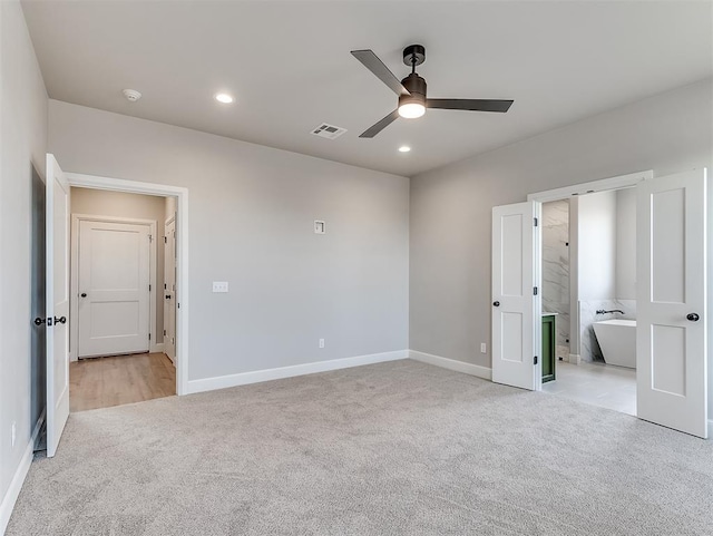 6209 Rivergate Dr, Shawnee, OK 74804 - unfurnished bedroom featuring ceiling fan, light carpet, and ensuite bath