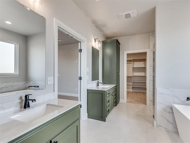 6209 Rivergate Dr, Shawnee, OK 74804 - bathroom with vanity, tile patterned flooring, and a tub