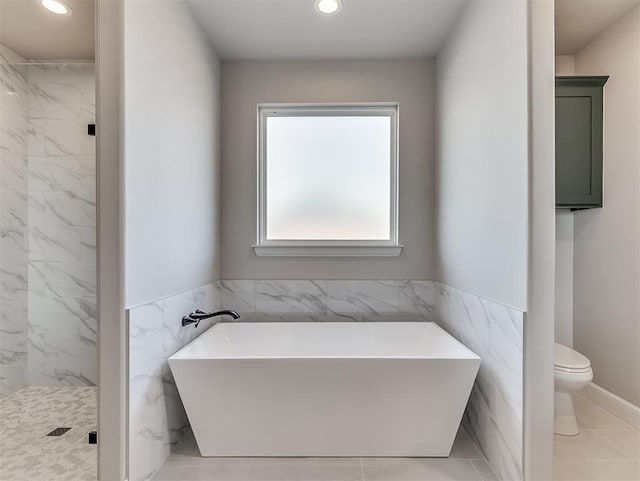 6209 Rivergate Dr, Shawnee, OK 74804 - bathroom featuring toilet, tile walls, and plus walk in shower
