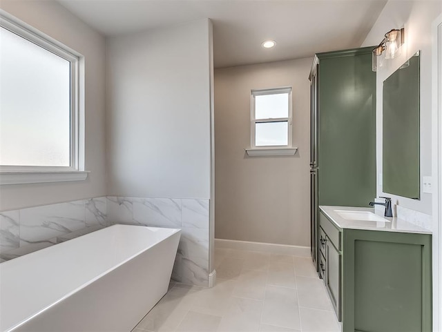 6209 Rivergate Dr, Shawnee, OK 74804 - bathroom with tile patterned floors, vanity, a bathing tub, and tile walls