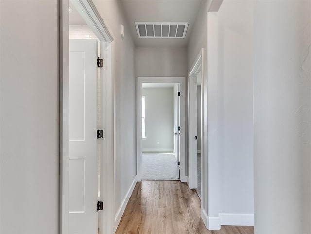 6209 Rivergate Dr, Shawnee, OK 74804 - hallway featuring light hardwood / wood-style flooring