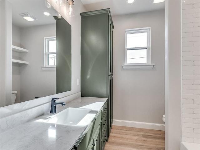 6209 Rivergate Dr, Shawnee, OK 74804 - bathroom featuring vanity, wood-type flooring, and toilet