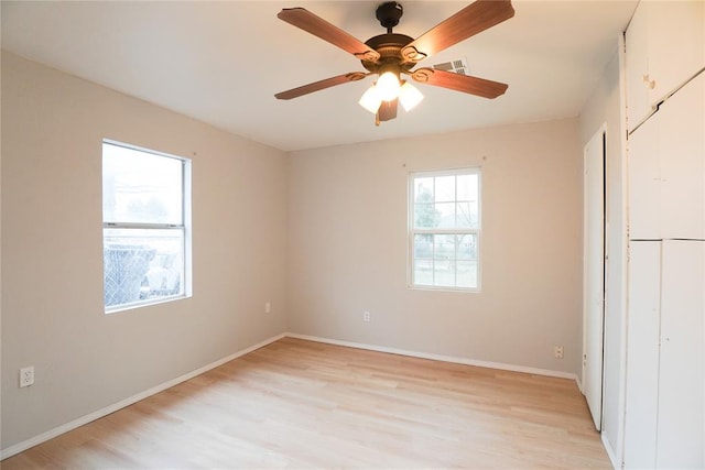 unfurnished bedroom featuring a closet, ceiling fan, and light wood-type flooring