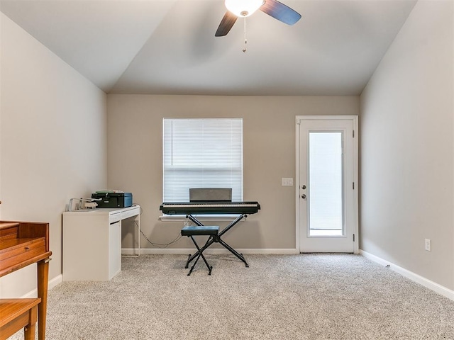 carpeted home office featuring ceiling fan and lofted ceiling