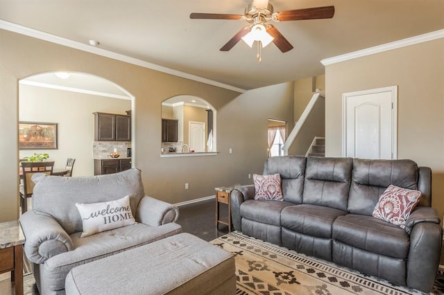 living room with crown molding and ceiling fan