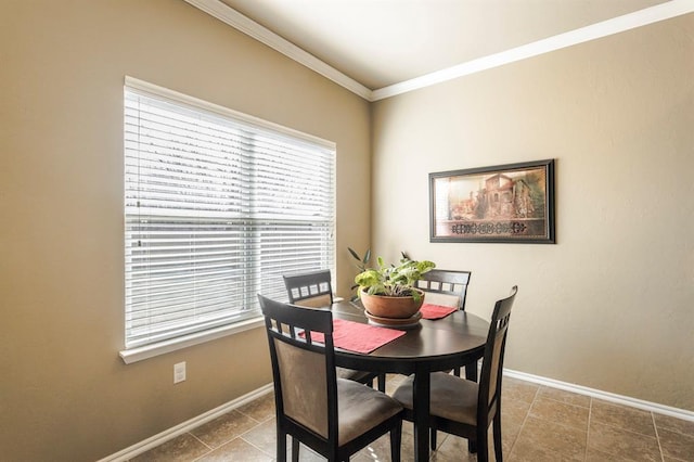 dining space with crown molding