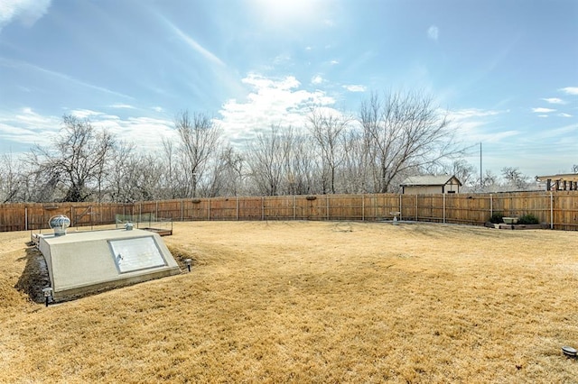 view of storm shelter with a yard