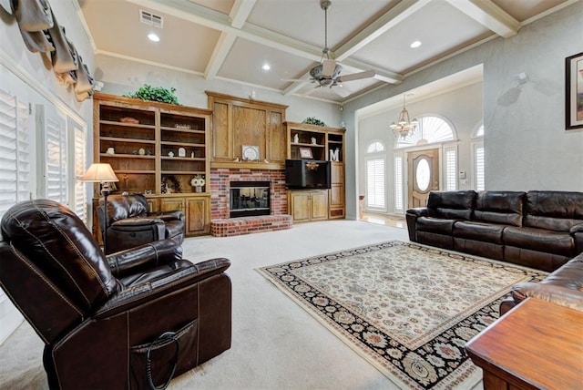 living room with ceiling fan with notable chandelier, coffered ceiling, light colored carpet, a brick fireplace, and beam ceiling