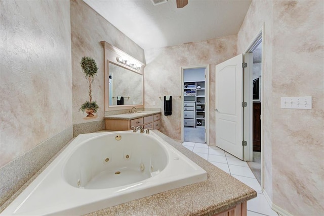 bathroom with vanity, tile patterned flooring, and a tub