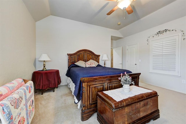 carpeted bedroom with lofted ceiling and ceiling fan