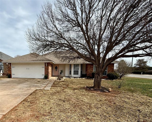 ranch-style house with a garage and a front lawn