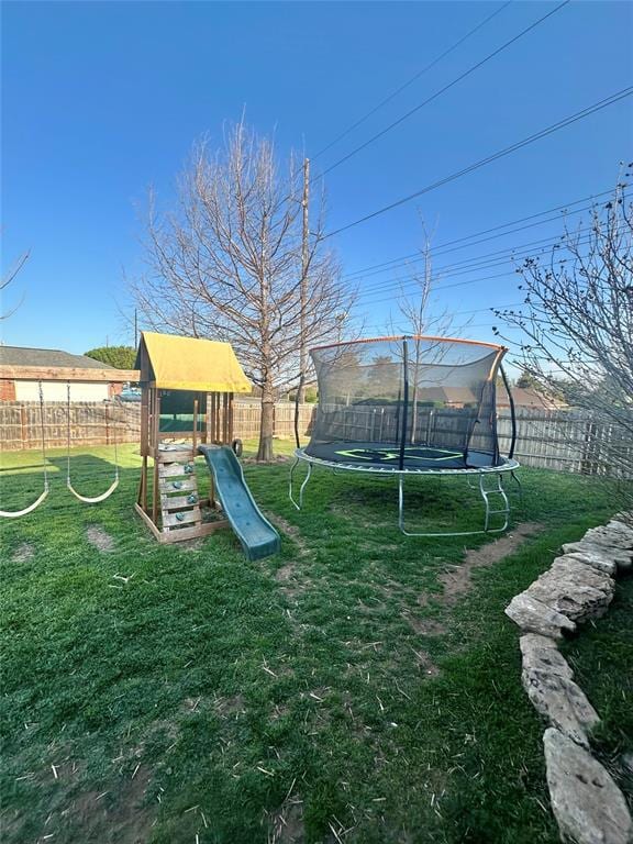 2800 Gettysburg Dr, Altus, OK 73521 - view of play area with a lawn, a trampoline, and a fenced backyard