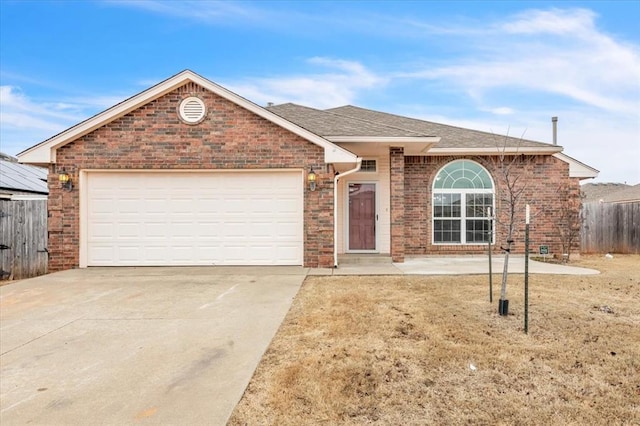 view of front of home featuring a garage and a front lawn