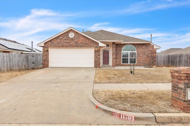 ranch-style home featuring a garage