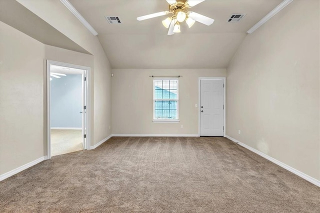 spare room with lofted ceiling, ornamental molding, ceiling fan, and carpet flooring