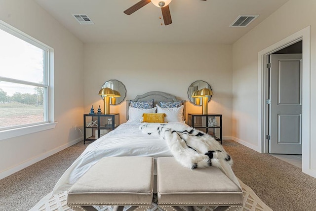 bedroom featuring carpet floors, visible vents, and baseboards