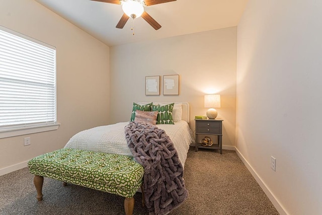 bedroom with ceiling fan, baseboards, and carpet flooring