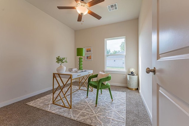 office area featuring ceiling fan, light colored carpet, visible vents, and baseboards