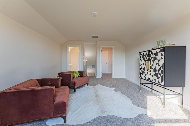 living area with vaulted ceiling, carpet floors, and baseboards