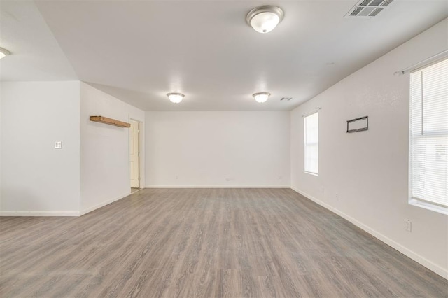 empty room with hardwood / wood-style floors