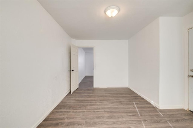 corridor featuring wood-type flooring