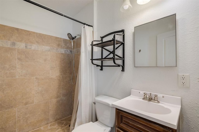 bathroom with vanity, toilet, and a shower with shower curtain