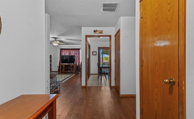 hallway featuring dark hardwood / wood-style floors