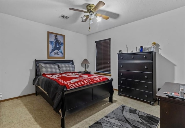 bedroom featuring light colored carpet and ceiling fan