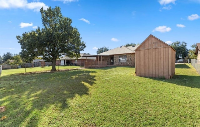 view of yard with a storage unit