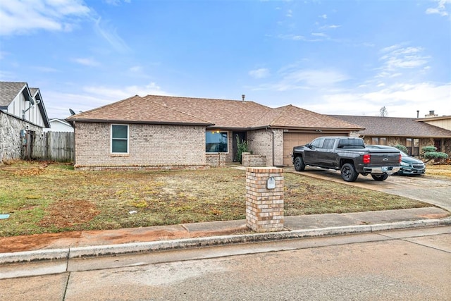 view of front of property with a garage and a front yard