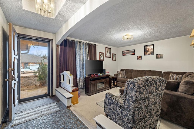 living room with carpet flooring and a textured ceiling