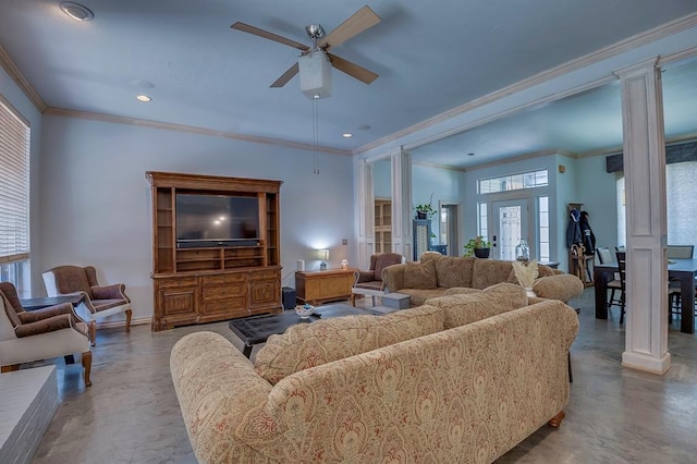 living room featuring ceiling fan, ornamental molding, concrete floors, and ornate columns